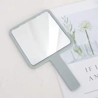 Hand held beauty mirror