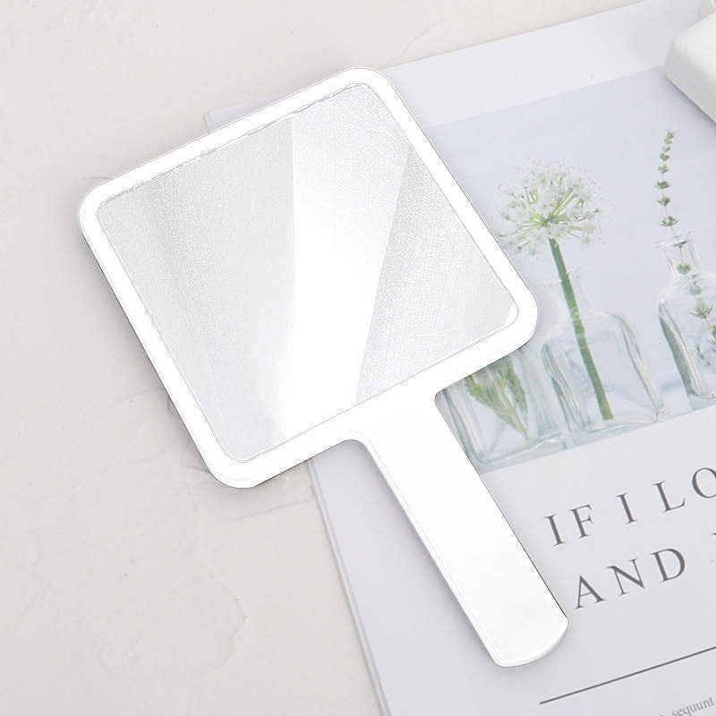 Hand held beauty mirror