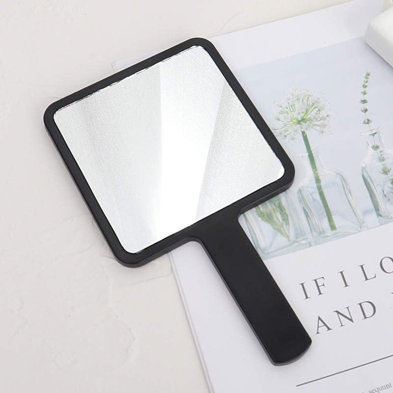 Hand held beauty mirror