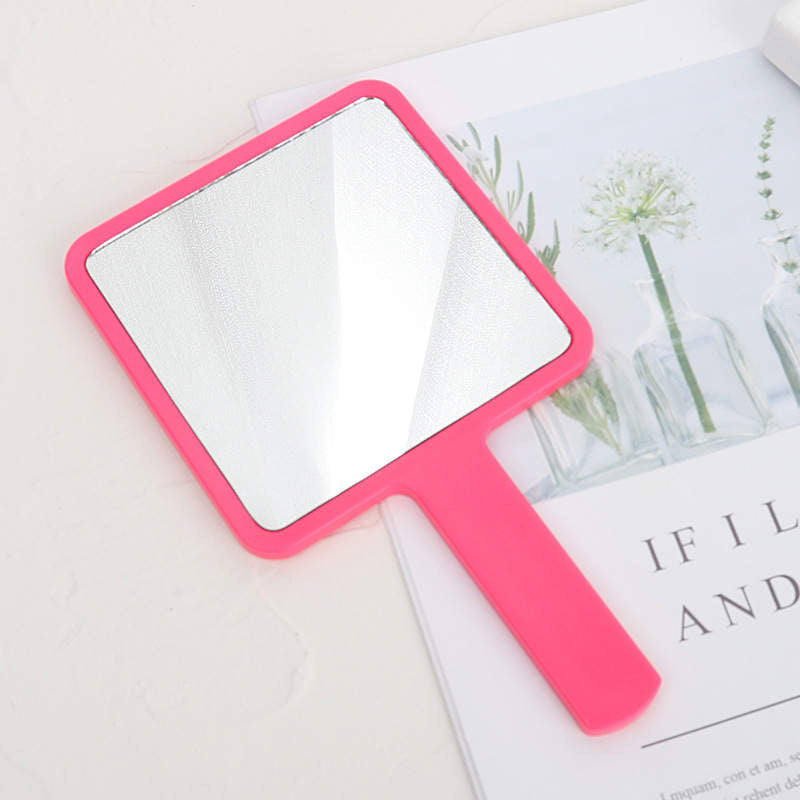 Hand held beauty mirror